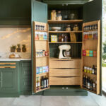 Green Kitchen with tall open pantry doors