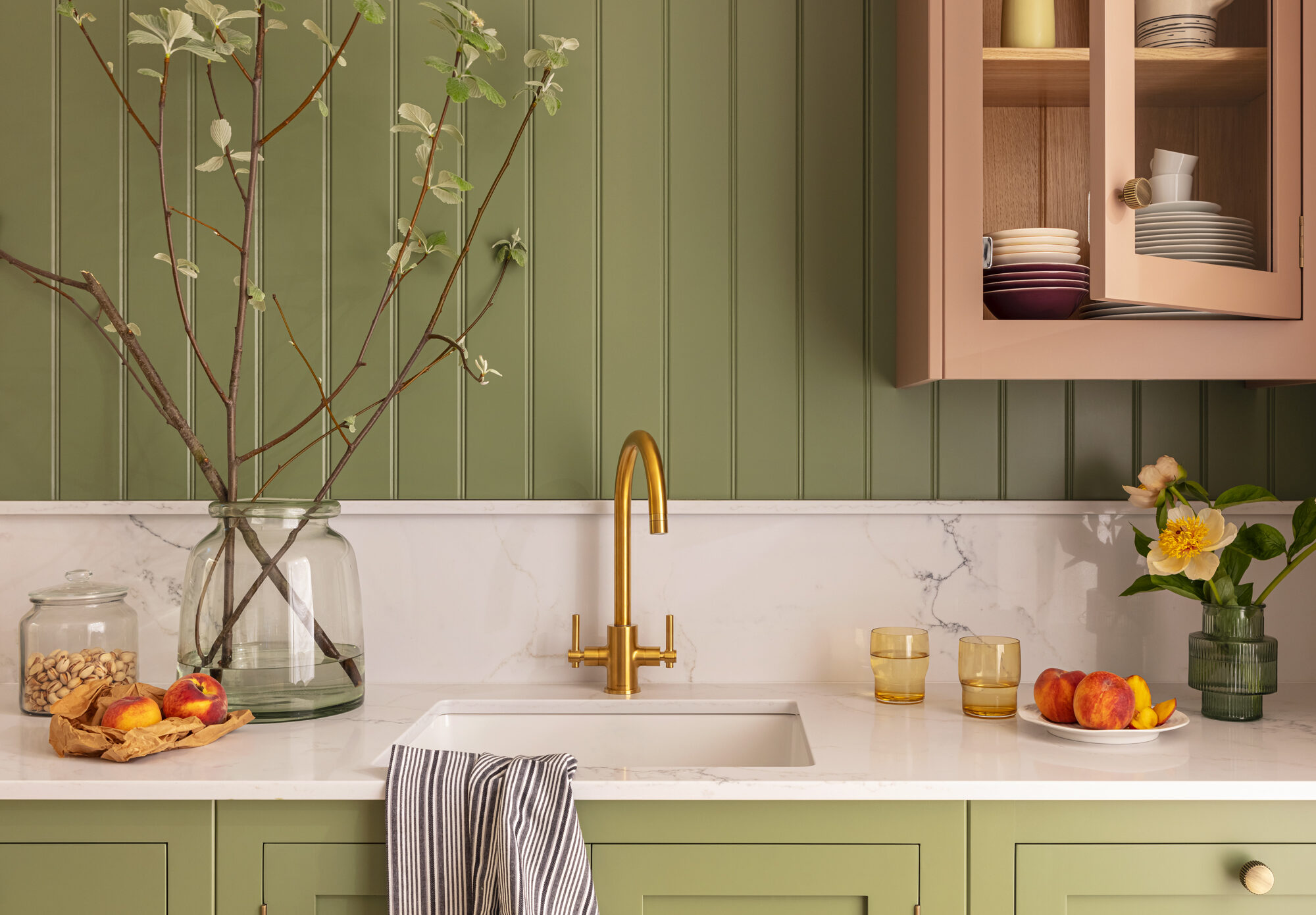 Hampton kitchen with green and pink cabinetry