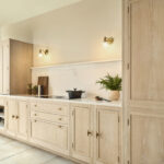 slim shaker kitchen in washed oak with floor to ceiling window