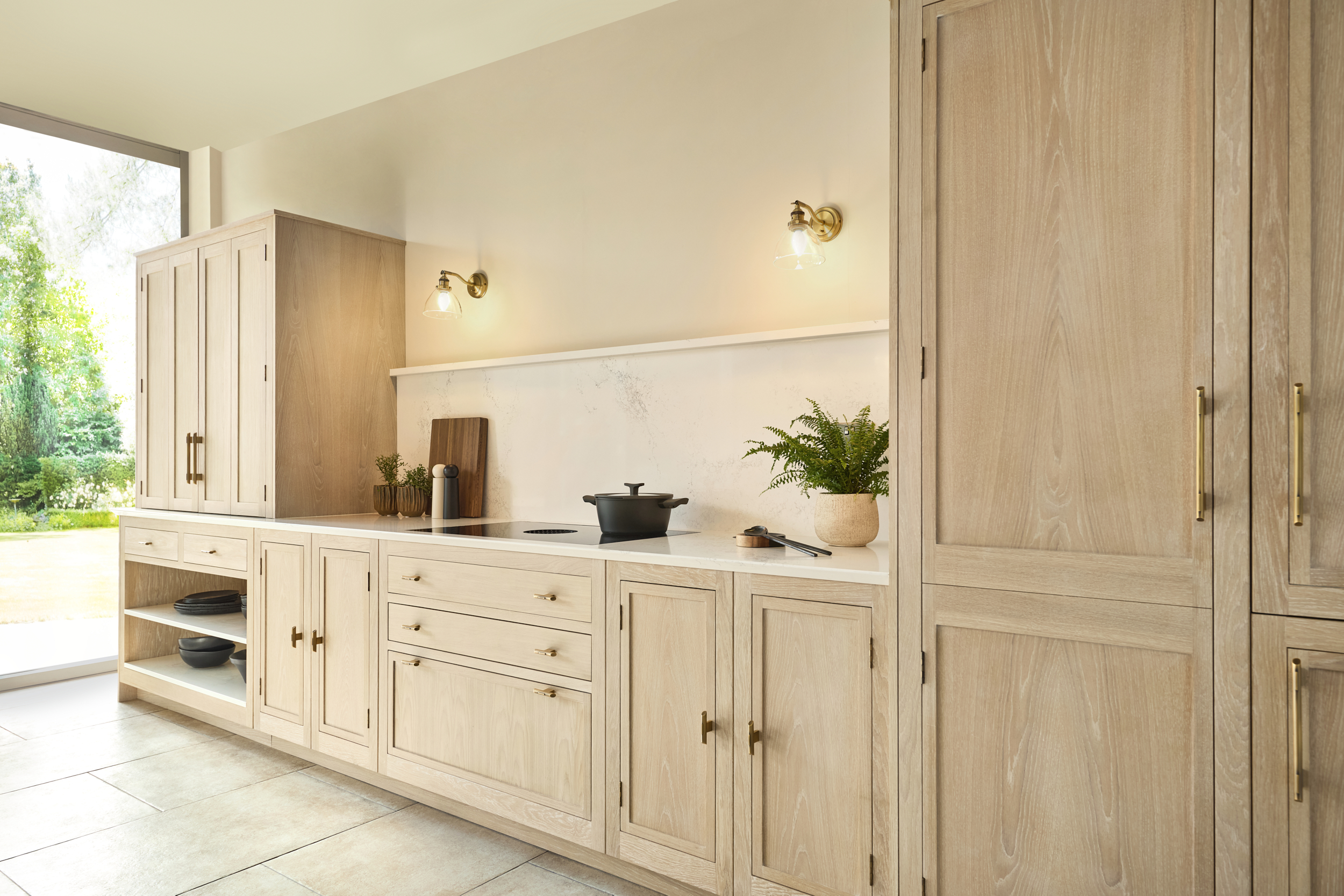 slim shaker kitchen in washed oak with floor to ceiling window