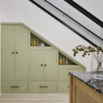 Bespoke integrated cabinetry under stairs