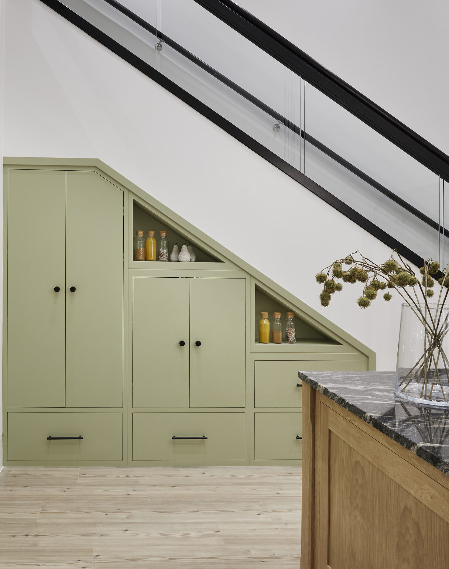 Bespoke integrated cabinetry under stairs