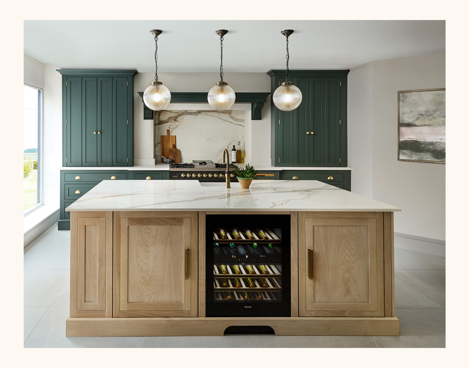 bespoke kitchen island in washed oak with green perimeter cabinetry