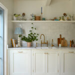 A bespoke kitchen, open shelves, kitchen sink, integrated appliances displays bespoke kitchen, open shelves, kitchen sink, and integrated appliances display a harmonious blend. the open shelves showcase a rustic charm, while the sleek sink seamlessly integrates for functionality. the integrated appliances, artfully arranged, create a space that is both elegant and efficient, inviting you to cook and entertain with ease.