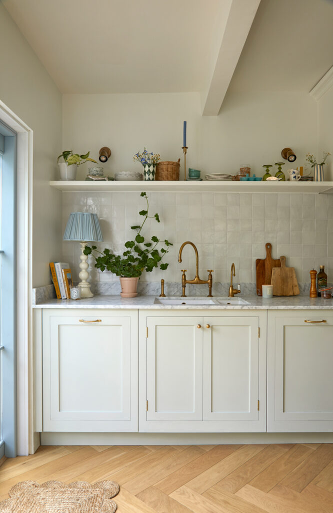 A bespoke kitchen, open shelves, kitchen sink, integrated appliances displays bespoke kitchen, open shelves, kitchen sink, and integrated appliances display a harmonious blend. the open shelves showcase a rustic charm, while the sleek sink seamlessly integrates for functionality. the integrated appliances, artfully arranged, create a space that is both elegant and efficient, inviting you to cook and entertain with ease.
