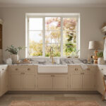 Luxury utility room with marble worktops, shaker cabinetry, and large window