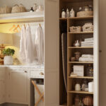 Utility storage with open shelving, baskets, and hanging rail for shirts