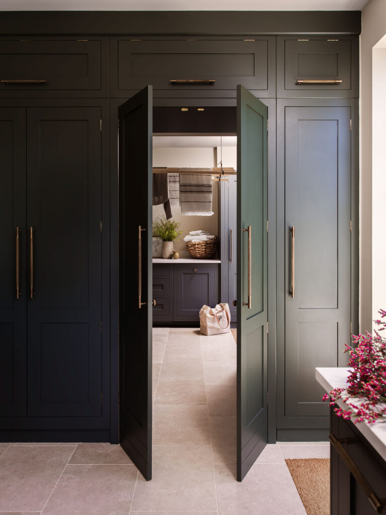 Luxury kitchen and hidden utility room with matching cabinetry