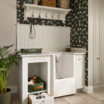 Built-in dog bed and feeding drawer in luxury utility room