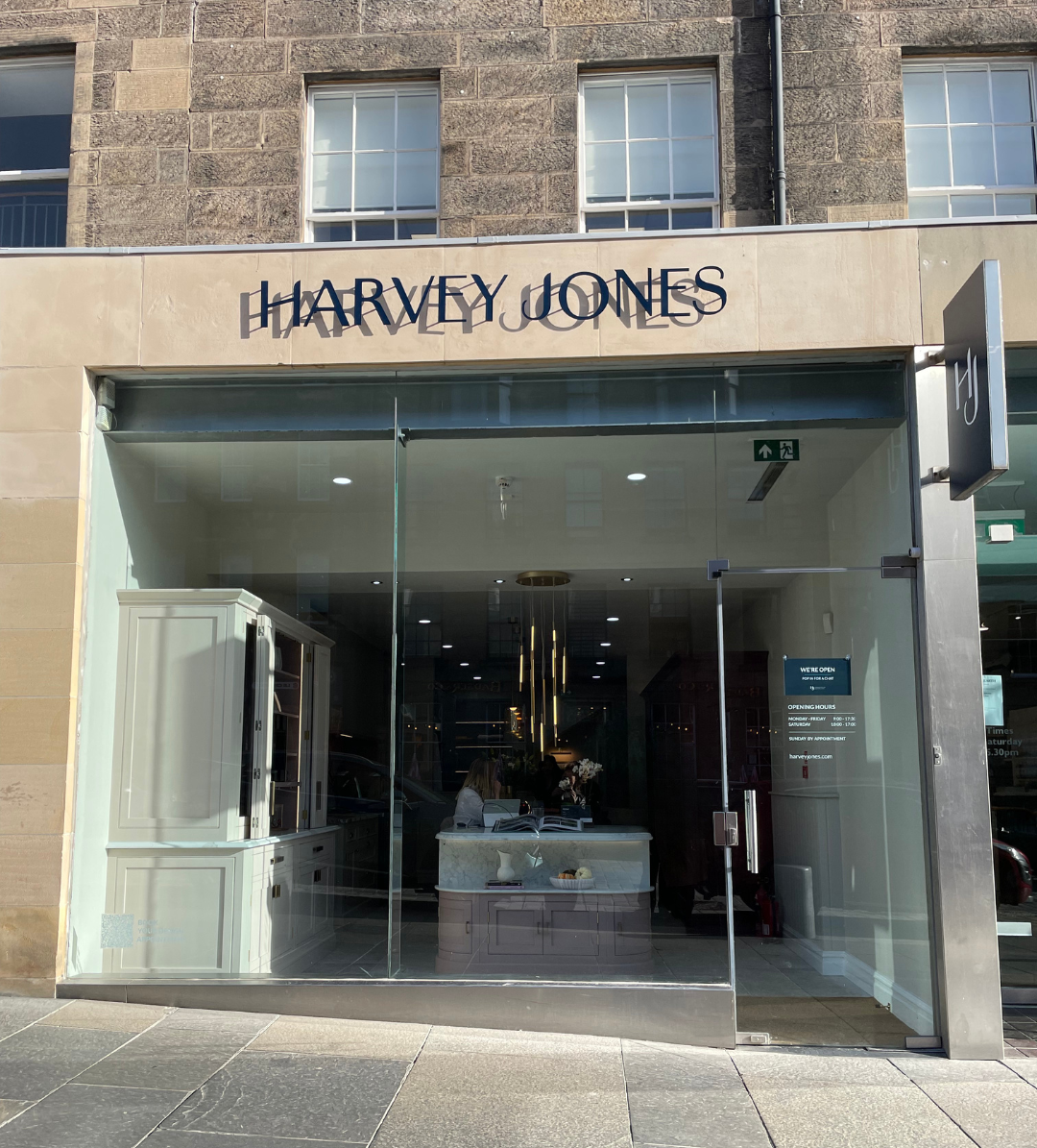 Harvey Jones Showroom in Edinburgh featuring large glass windows, with a kitchen display visible inside.