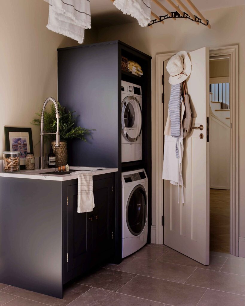 Luxury utility space with smart storage, built-in appliances, and coordinated design details throughout.