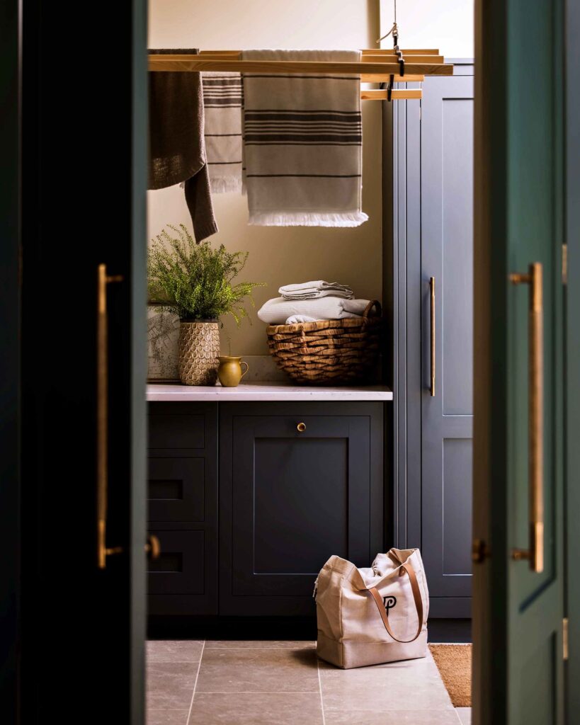 Bespoke utility room design with custom cabinetry and concealed laundry storage for a clean, luxury finish.