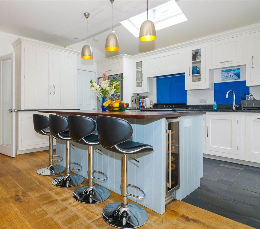 Harvey Jones kitchen space prior to refurbishment, featuring dated colours and decor.
