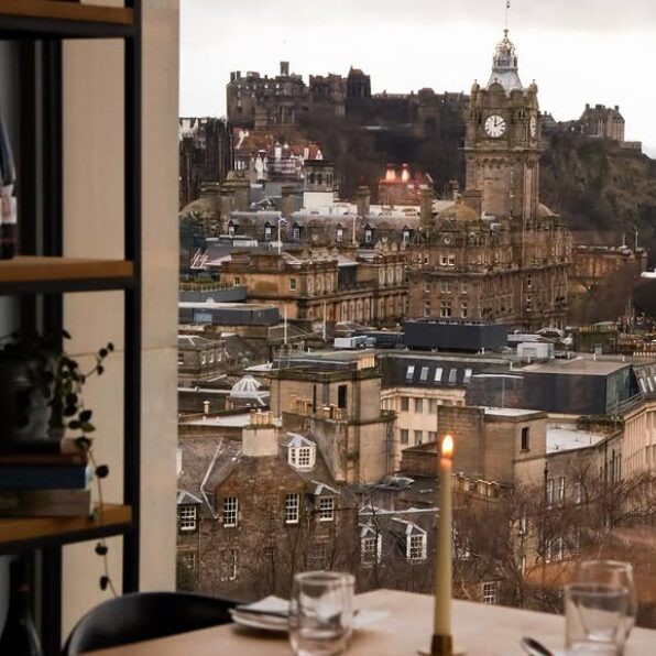 view over Edinburgh with a dining table in the foreground
