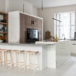 Modern Shaker kitchen with oak cabinets and white island