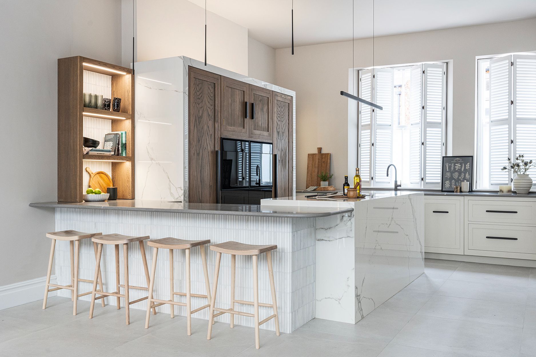 Shaker kitchen with open oak shelving and marble island