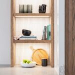 Lit shelving detail in modern Shaker kitchen