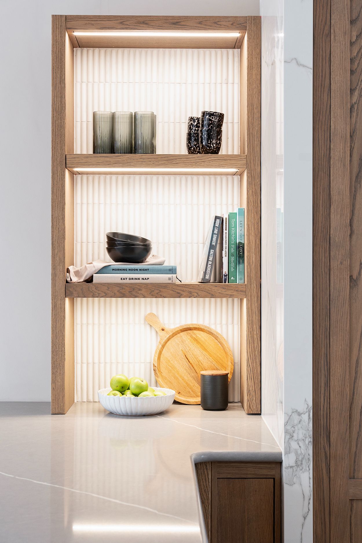 Lit shelving detail in modern Shaker kitchen