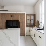 Oak appliance wall in a modern Shaker kitchen