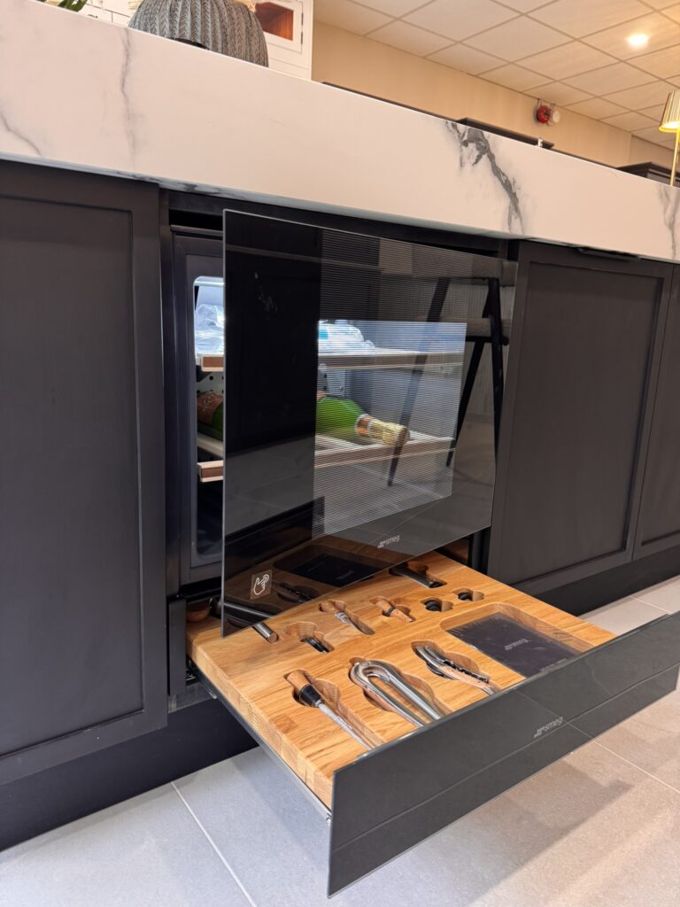 Bespoke wine cooler in kitchen island with integrated wine utensil drawer