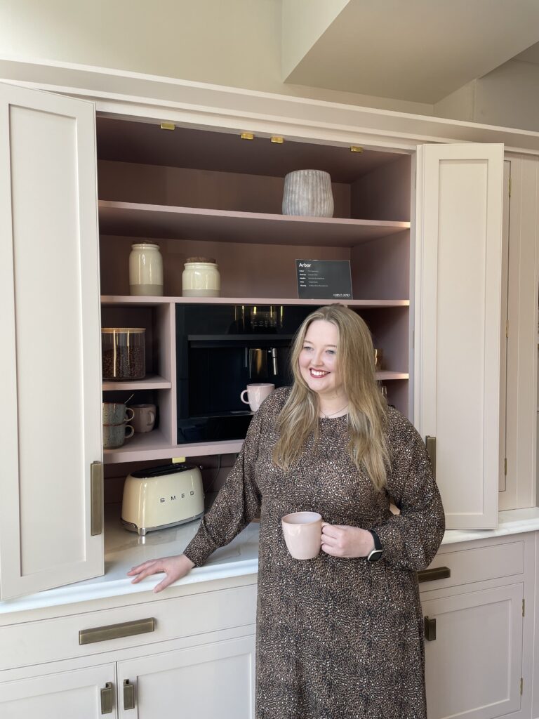 woman standing in front of pink bespoke breakfast dresser