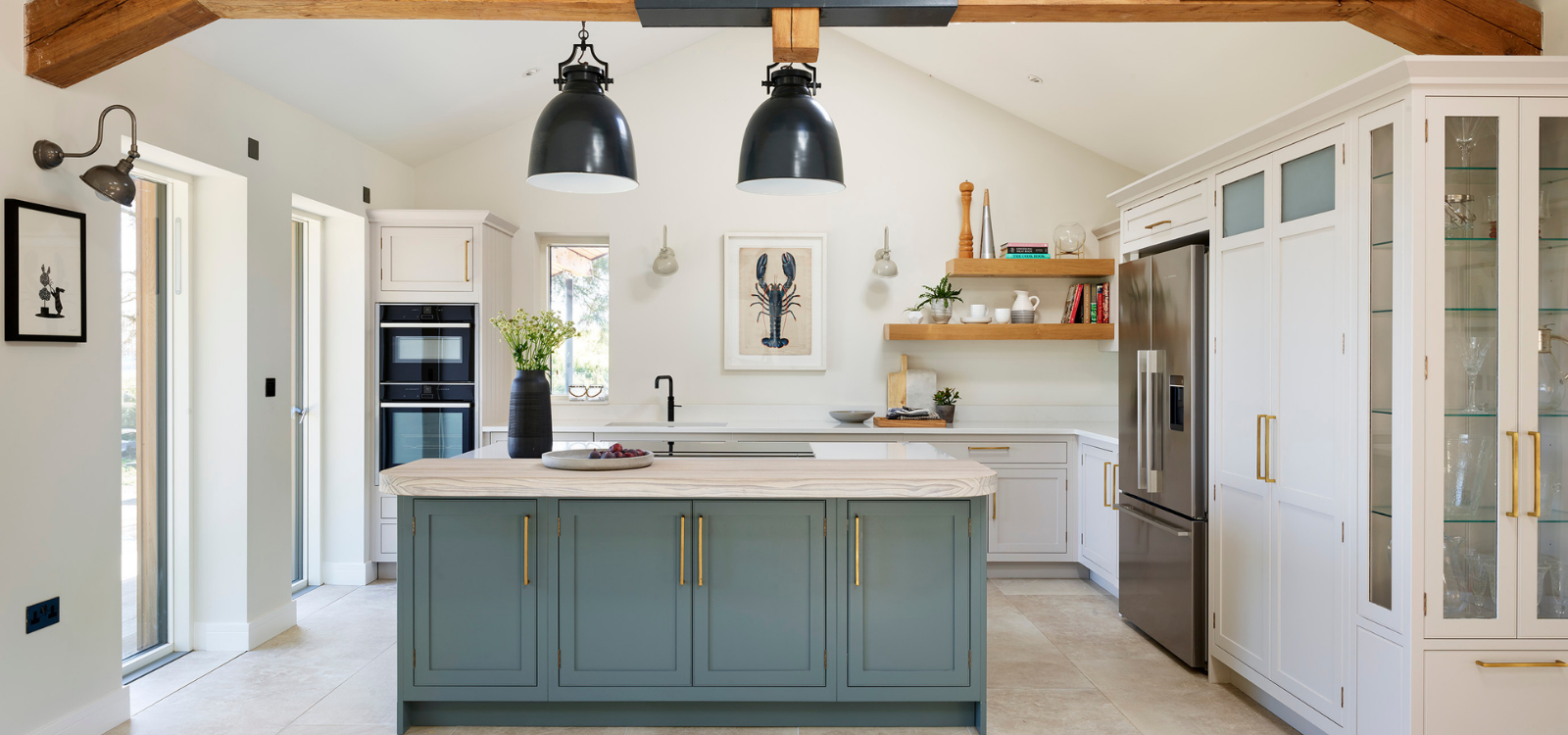 Blue and white kitchen with gold accents and textured island