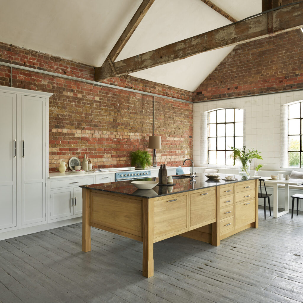 Natural wood kitchen island featuring trending kitchen design style