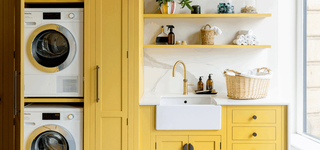 Yellow bespoke utility room with stacked appliances, open shelving and sink space