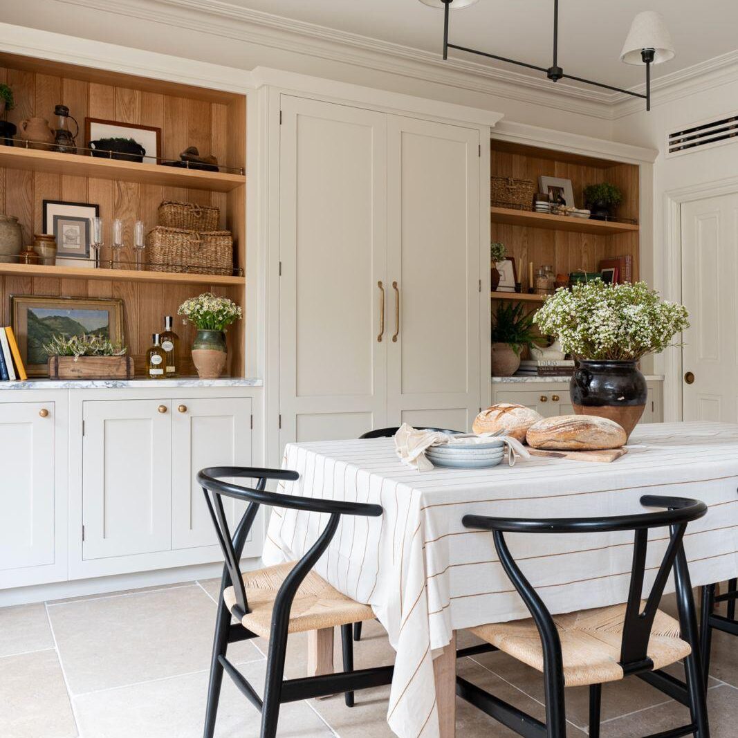 Bespoke kitchen dresser storage with open shelves featuring personal details