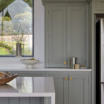 Tall larder cabinets providing hidden breakfast and pantry storage