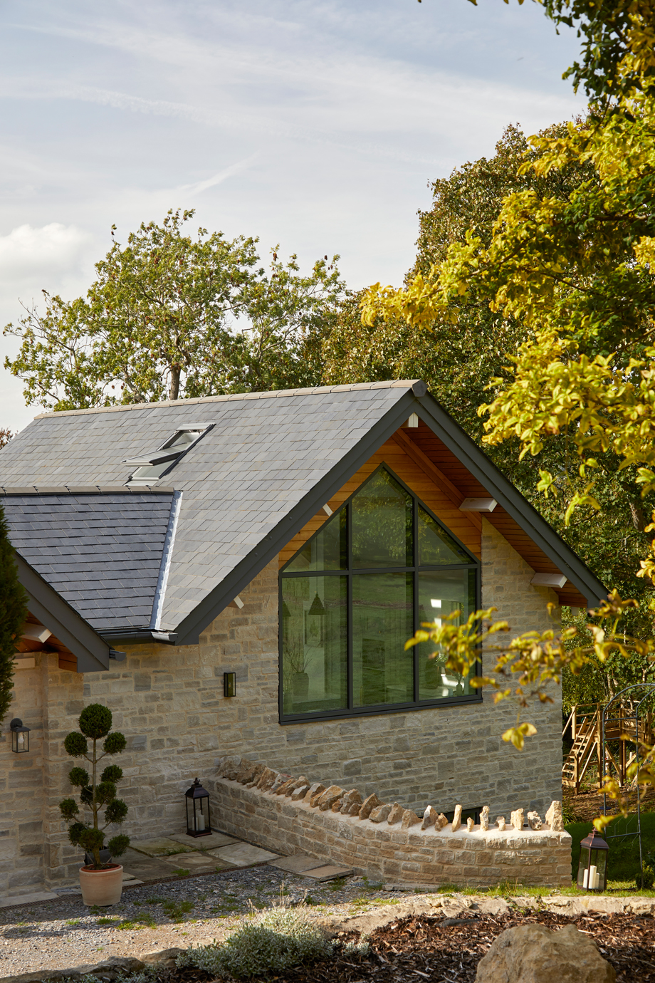 Exterior view of the gable end window illuminating the open plan kitchen.
