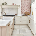 Soft pink luxury kitchen with classic cabinetry and modern features
