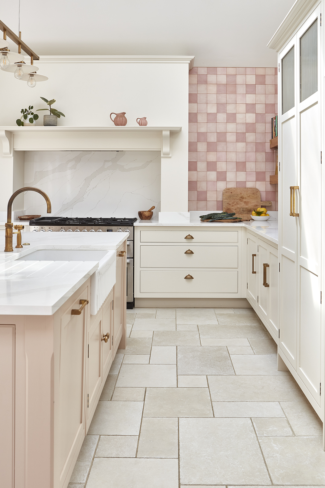 Soft pink luxury kitchen with classic cabinetry and modern features