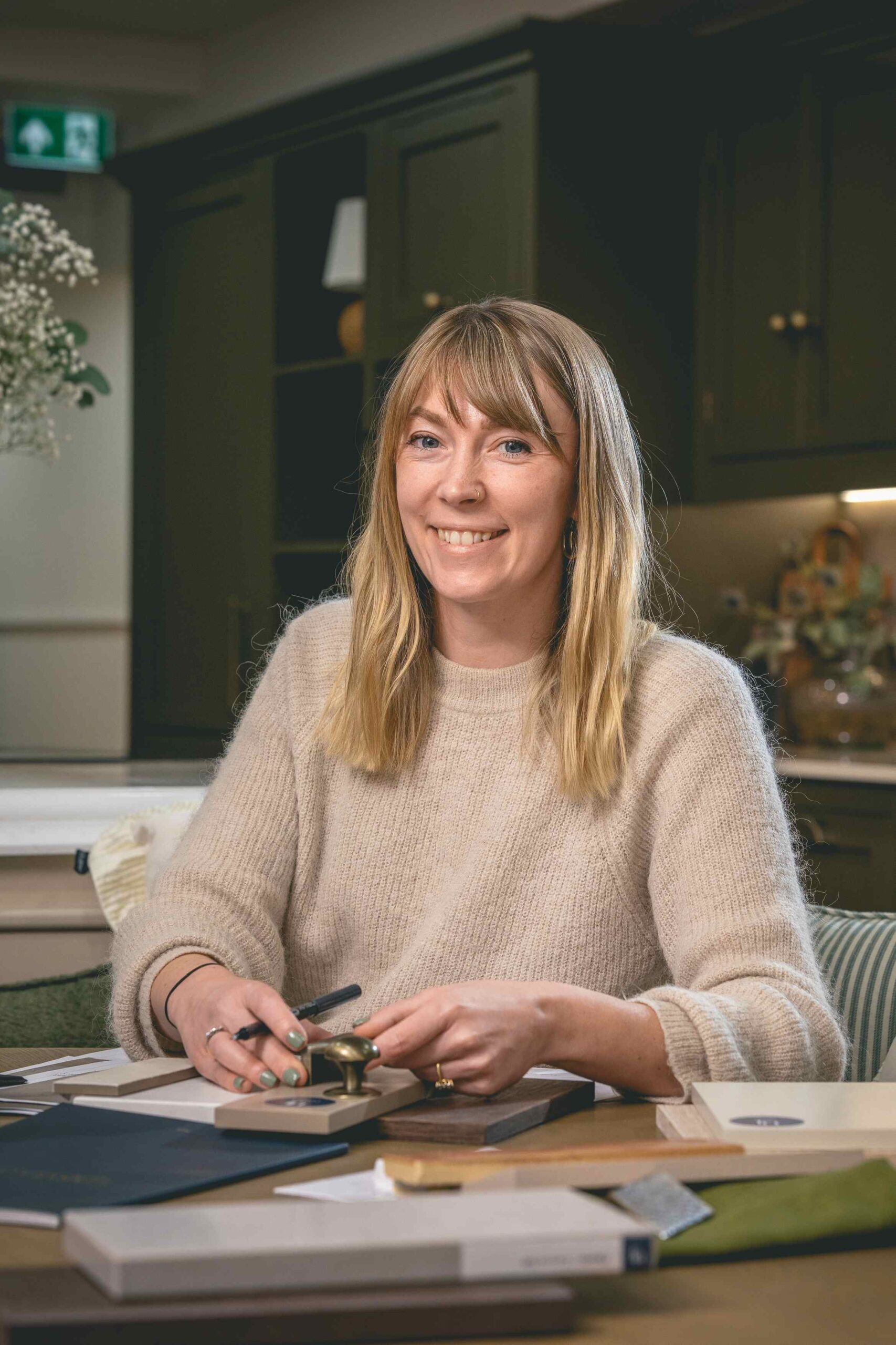 harvey jones designer holding bespoke samples