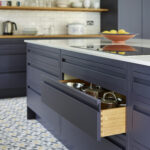 Navy kitchen island storage integrated drawer storage, showcasing practical bespoke cabinetry solutions.