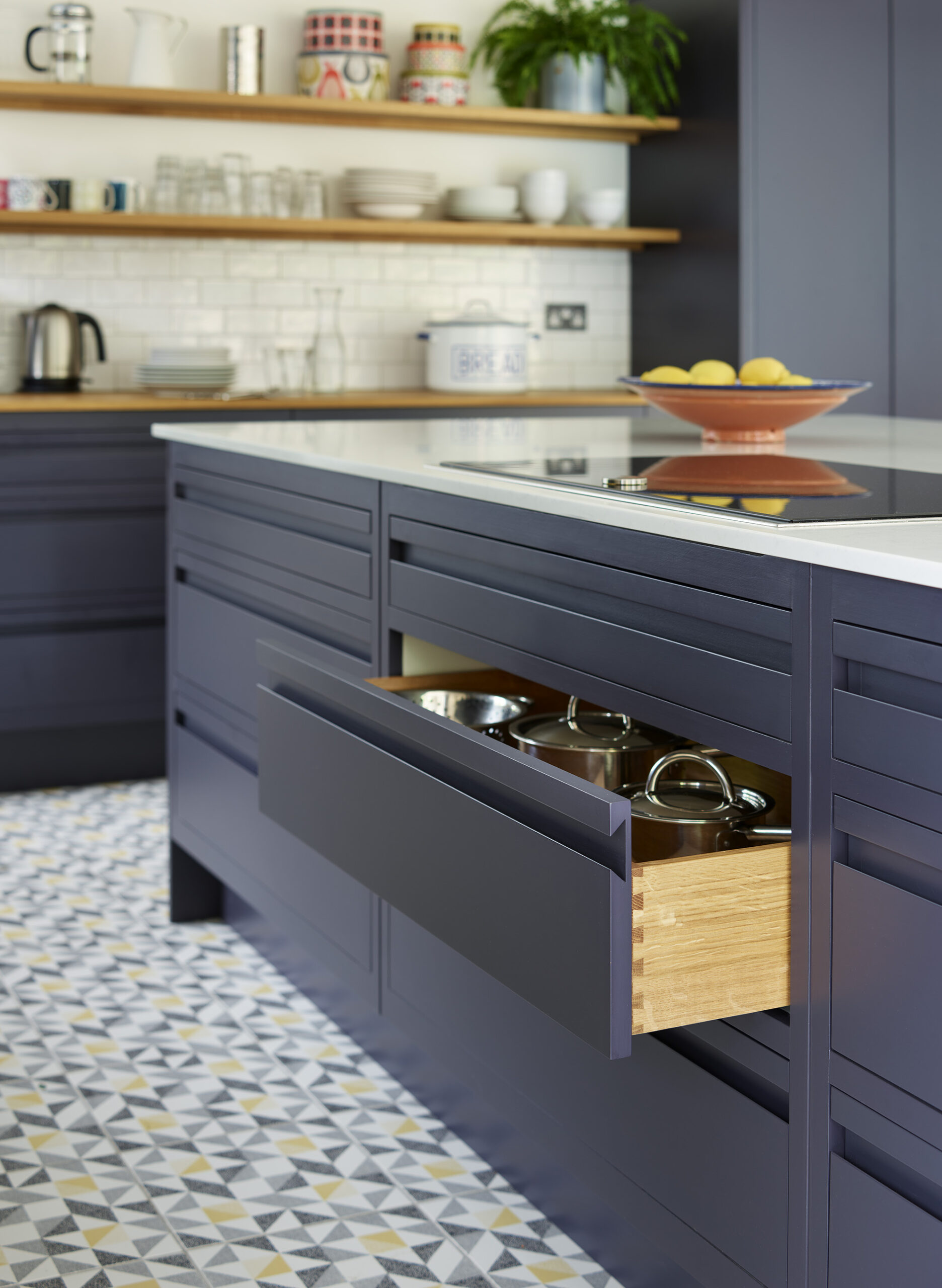 Navy kitchen island storage integrated drawer storage, showcasing practical bespoke cabinetry solutions.