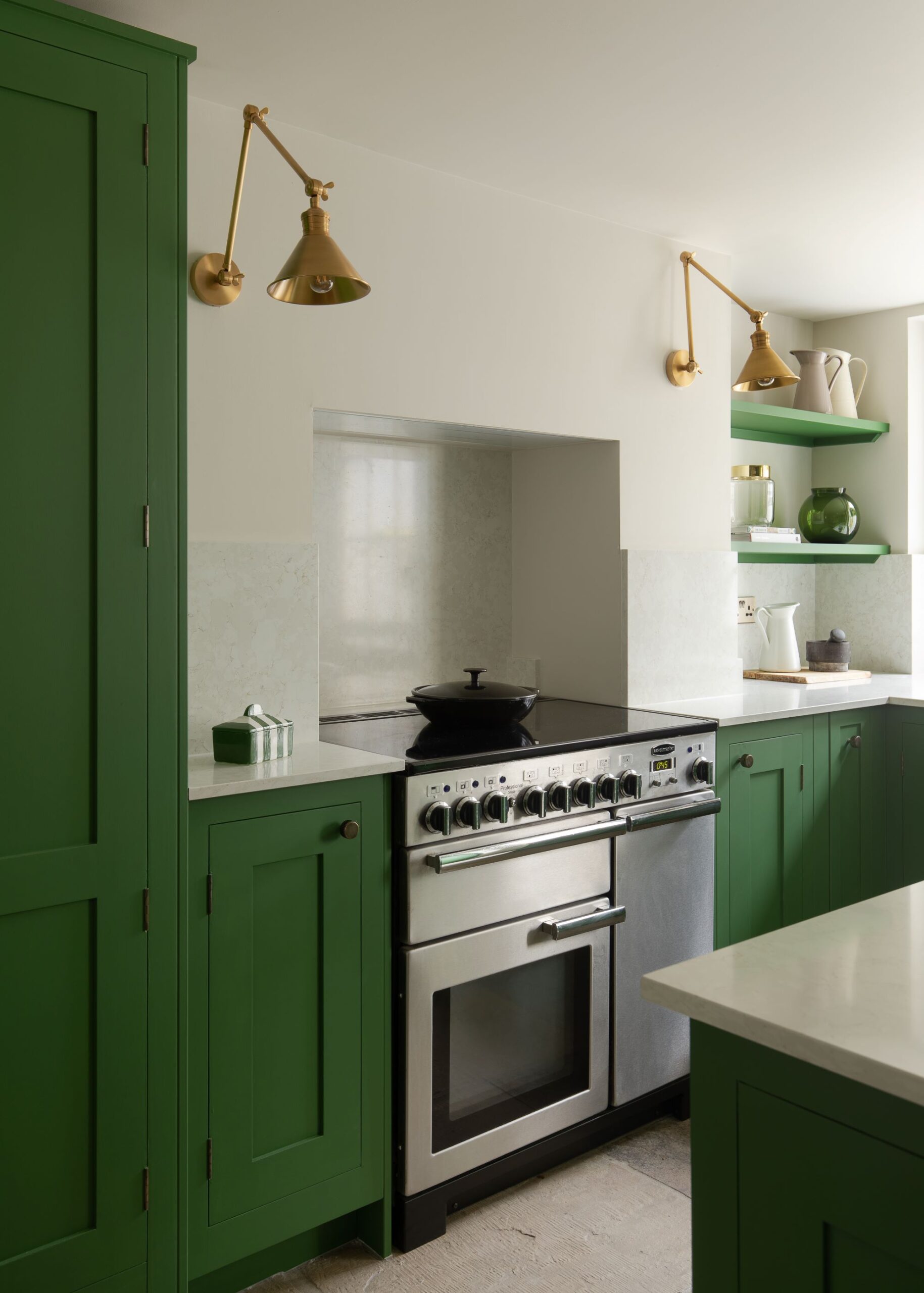Green bespoke kitchen with classic range cooker