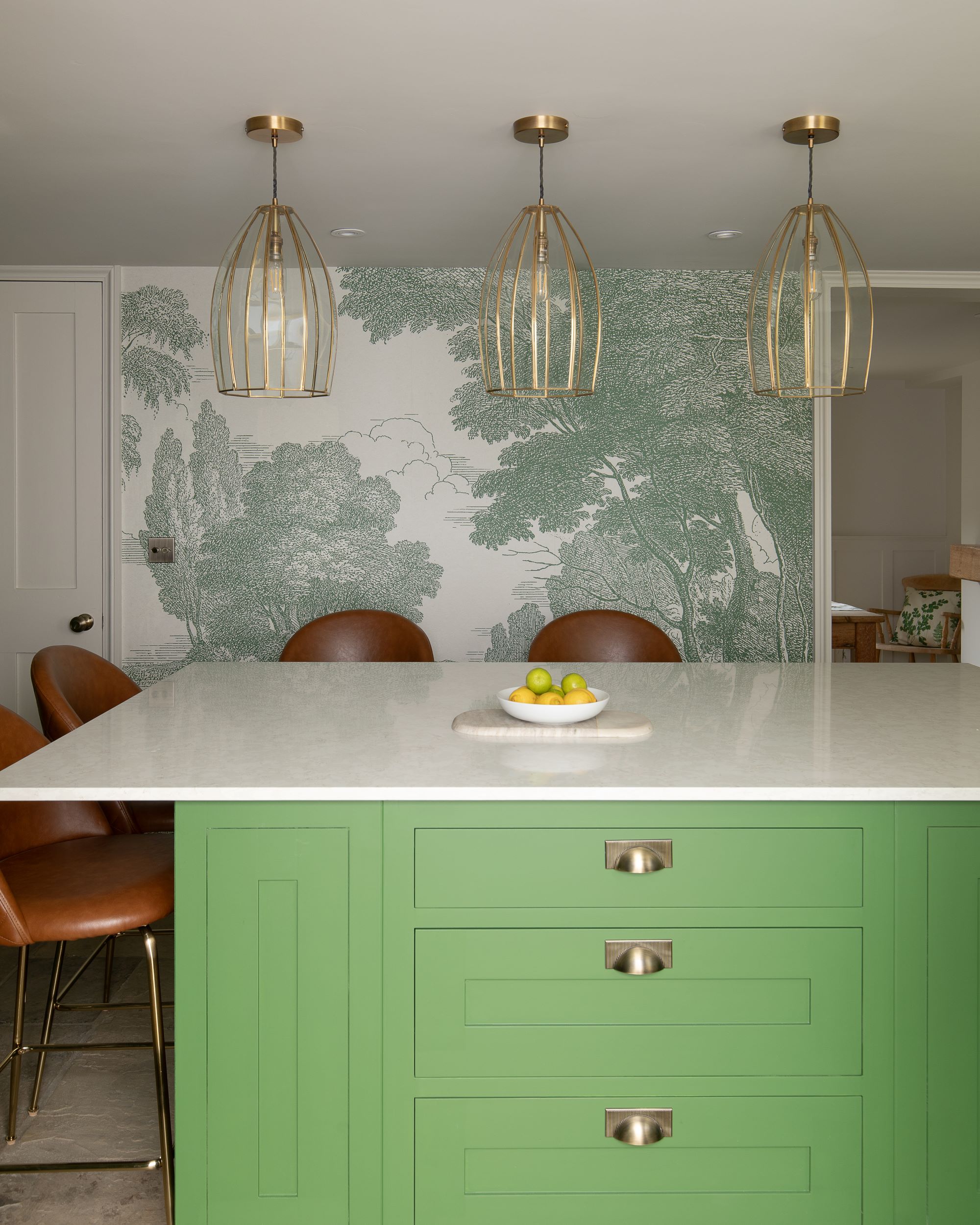 Social green kitchen island with white worktop