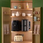Hidden pantry larder and breakfast dresser with light oak wood interior