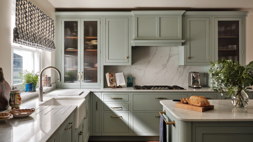 Bespoke earthy kitchen with curved island and natural wood elements