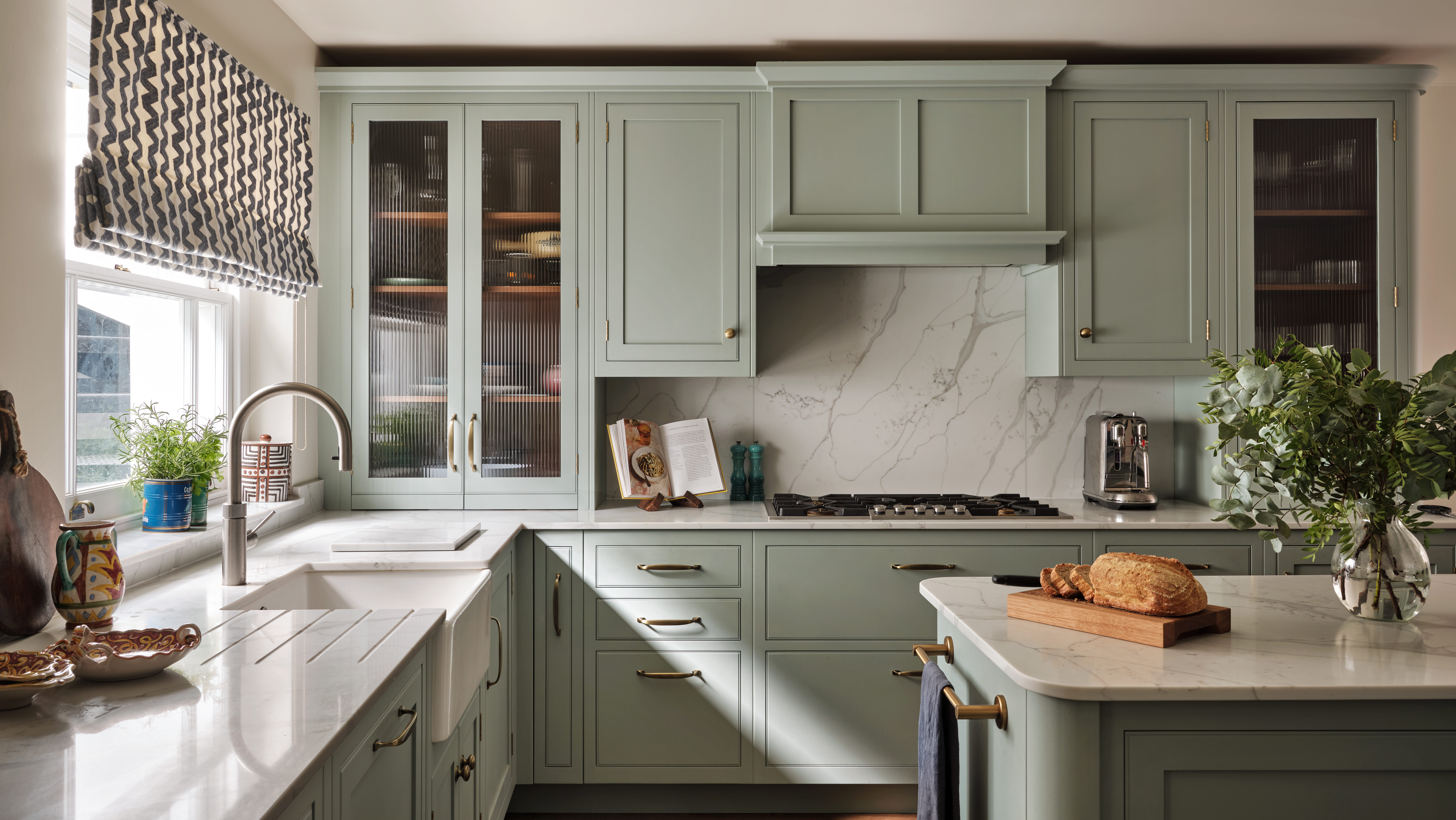 Bespoke earthy kitchen with curved island and natural wood elements