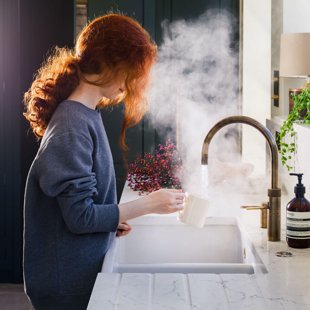 Quooker boiling tap in a luxury kitchen with quartz countertops