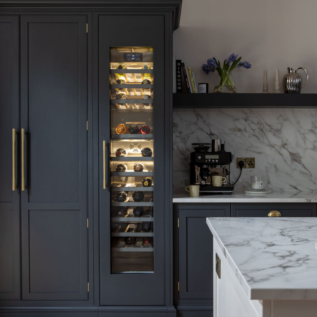 Integrated wine fridge in luxury kitchen with lighting and extra storage