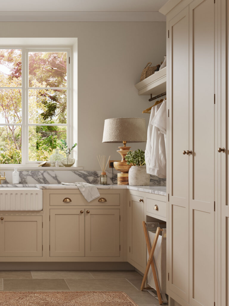 Traditional utility room design with under counter storage, bespoke shaker cabinetry and hanging space