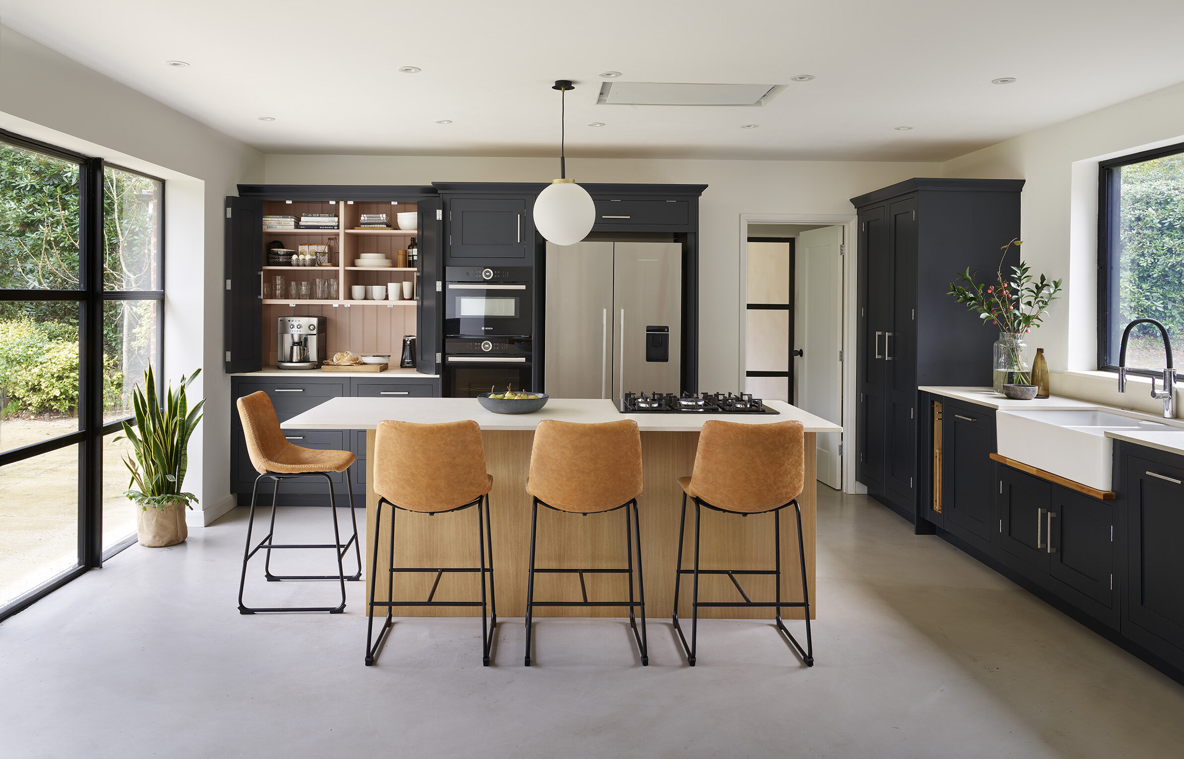 Navy shaker kitchen with wooden statement island 