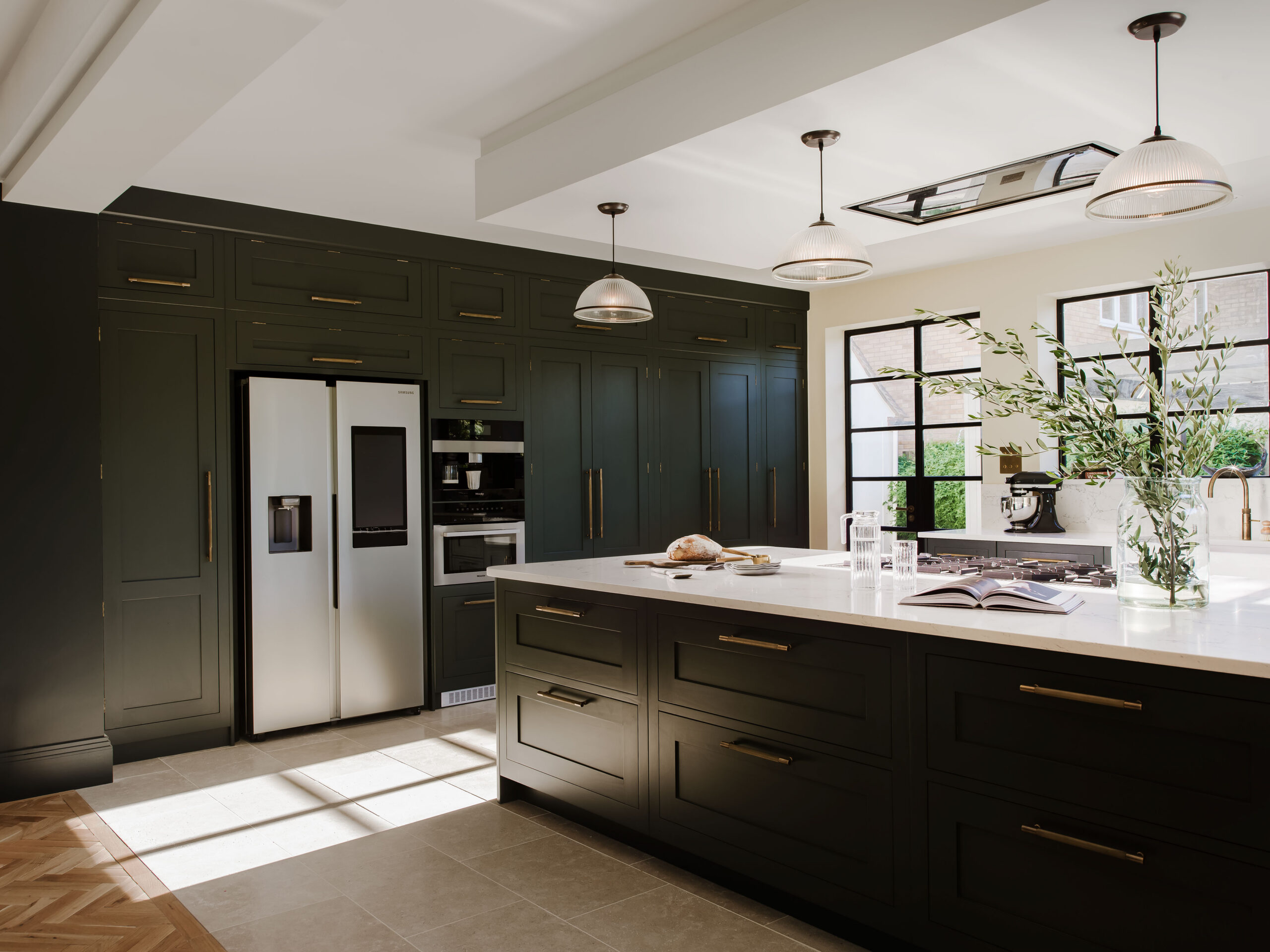 Dark green shaker kitchen with bespoke floor to ceiling cabinetry