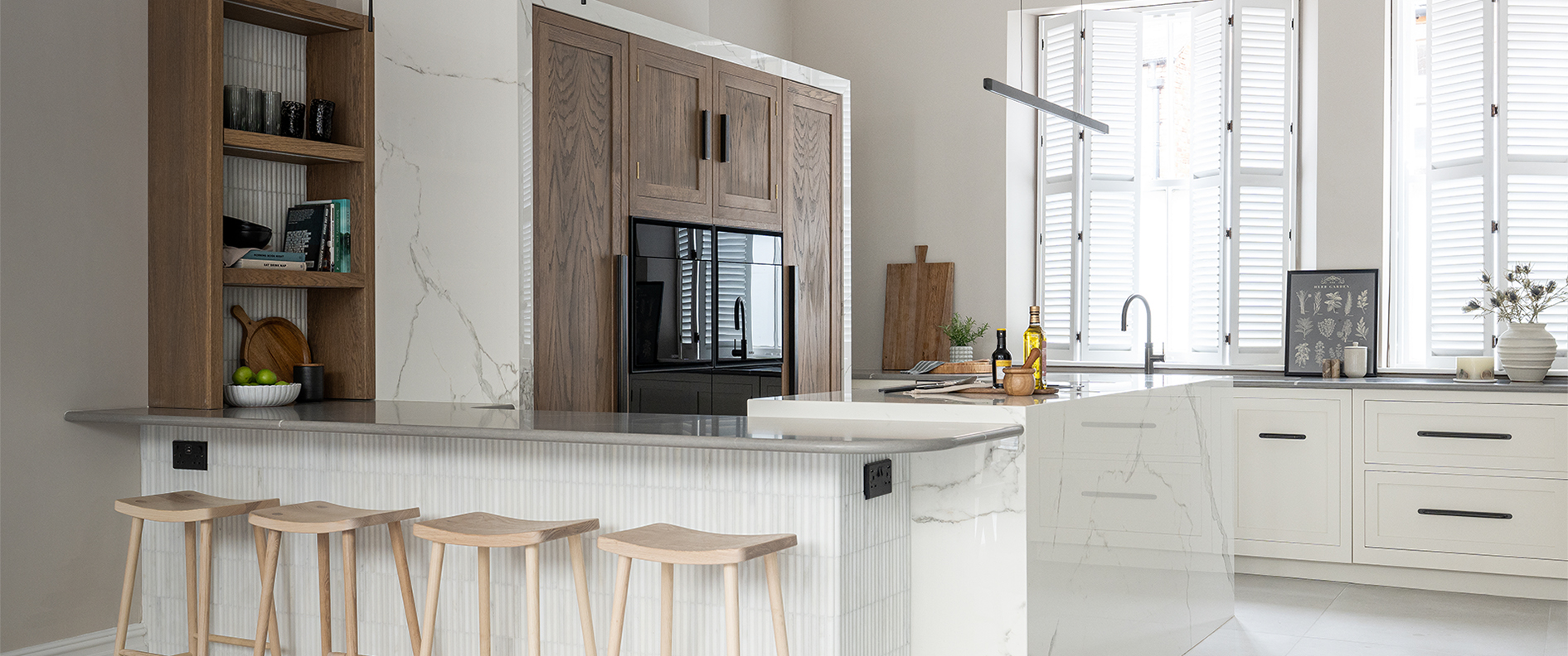 White and wood luxury kitchen with seating
