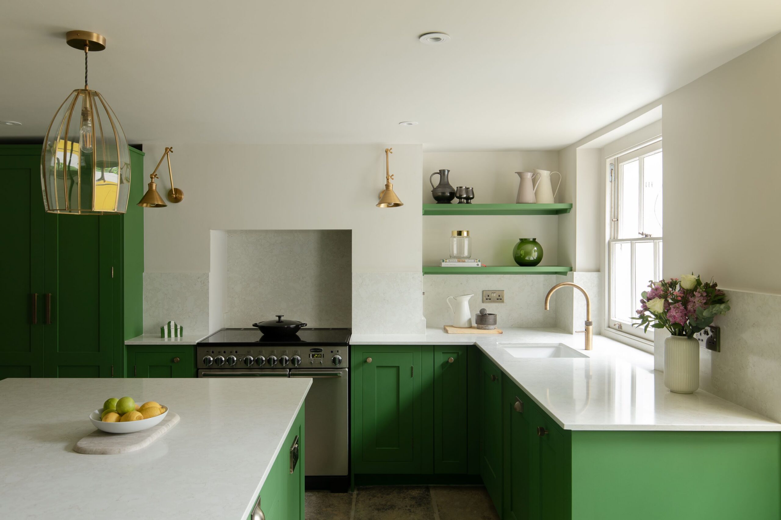 Green shaker kitchen design with open shelving and minimal design