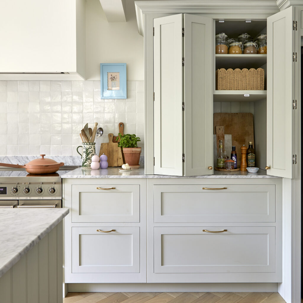 Bespoke breakfast dresser integrated into kitchen cabinetry with worktop space and shelving