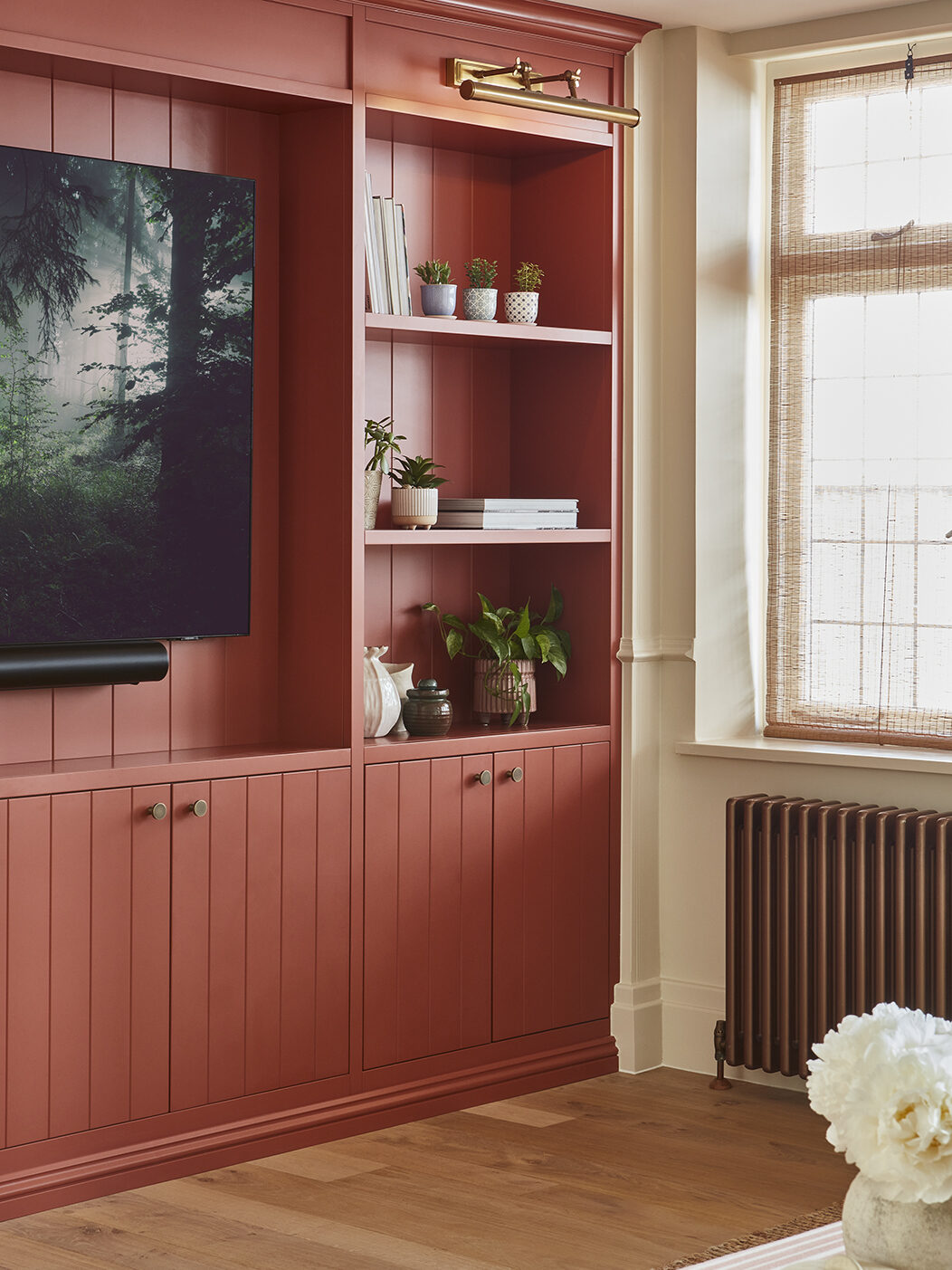 Bespoke pink media wall with tongue and groove panelling